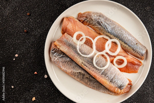 Fototapeta Herring fillet fish fresh seafood portion size natural product tasty snack fresh delicious gourmet food background on the table rustic top view copy space pescetarian diet