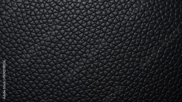 Fototapeta Close-up of black leather texture with intricate patterns, highlighting detail and sophistication.