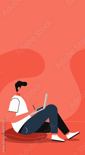 Fototapeta Man working on laptop with stylus, sitting comfortably on cushion in a relaxed, modern setting. Ideal for remote work, education, or creative concepts.