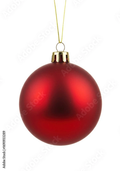 Fototapeta Shiny red holiday ornament hanging by a string, commonly used for decorating Christmas trees, isolated on white background.
