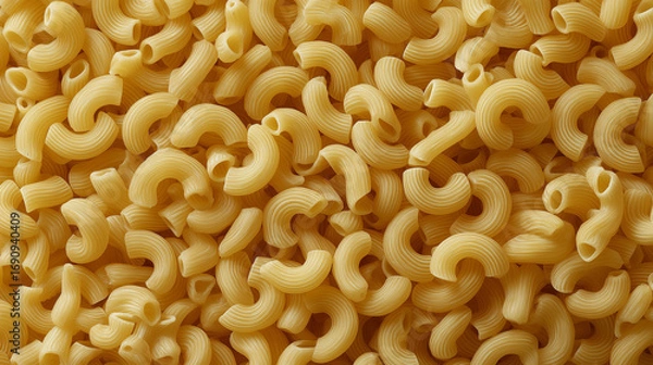 Obraz hyper-realistic photograph to use as computer wallpaper featuring an attractive flat layout of dried elbow macaroni, all in a uniform yellowish pasta color

