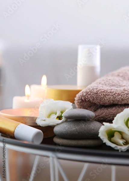 Fototapeta Beautiful spa composition of towels and spa accessories. Vertical photo format