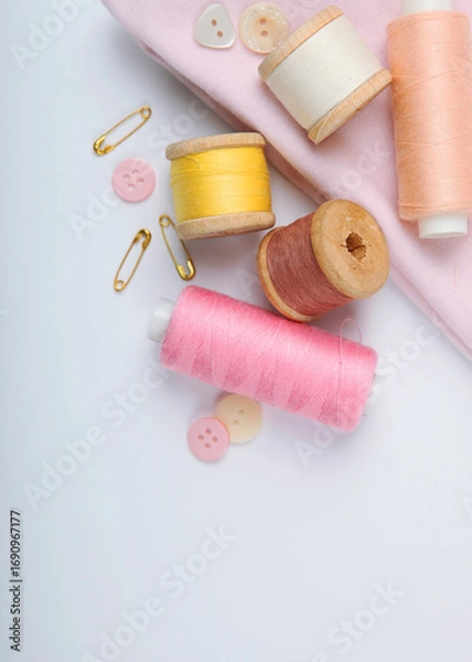 Fototapeta different sewing accessories on the table close-up. Vertical photo format