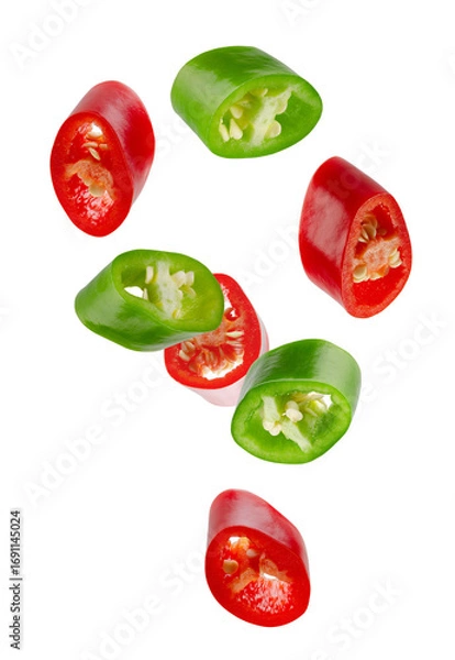 Fototapeta Mixed slices of green and red hot chili peppers falling in space. Isolated on white
