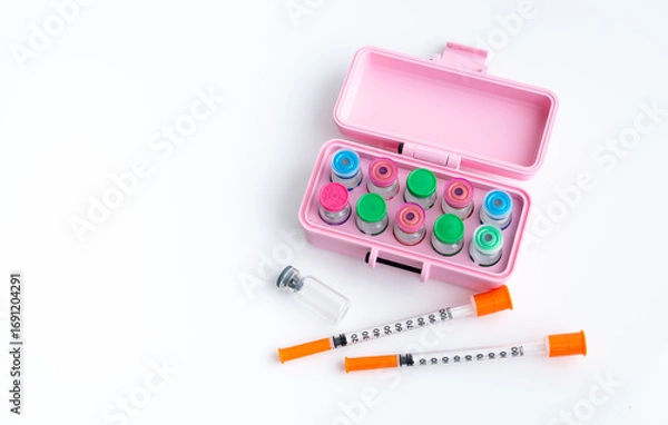 Fototapeta Close up of Pink Case with Vials of Various peptides