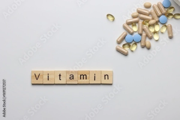 Fototapeta Vitamins pills and injectable in a white background