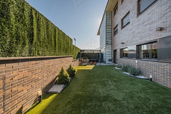 Fototapeta Panoramic terrace with   top-quality deep green artificial grass