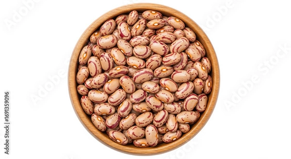 Fototapeta Overhead close-up shot of a wooden bowl filled with pinto beans on a white background. These beans are a common ingredient in many cuisines
