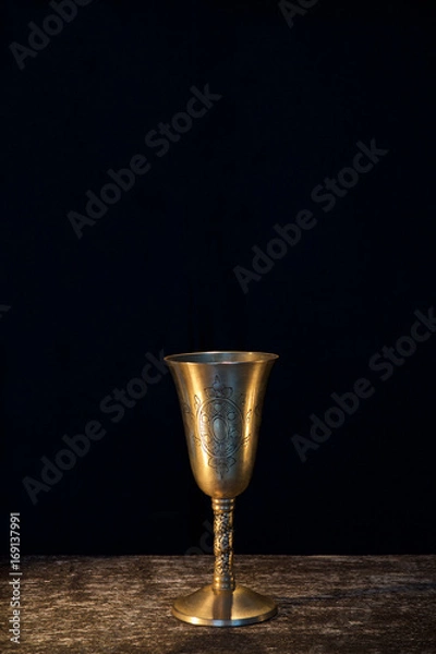 Obraz Vintage goblet for wine on black background
