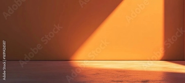 Fototapeta Minimalist orange studio background with abstract light projection for product display