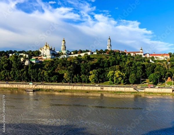 Fototapeta Panoramic view of a city with churches on a hill overlooking a river