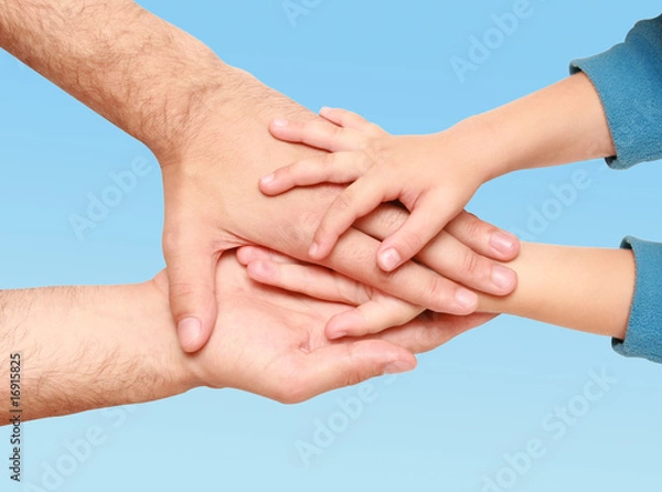 Fototapeta hands of the child in the hands of an adult male