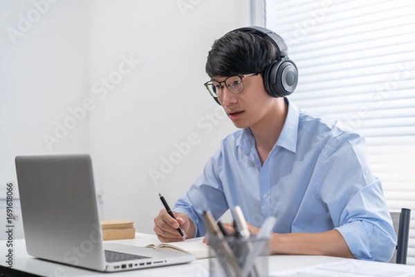 Fototapeta E learning Student online VDO Call Conference Work from home with cat remote work talk chat online on laptop webcam conference working with tablet social distancing concept