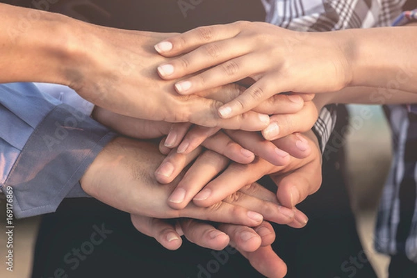 Fototapeta Business people and architects join hands for teamwork and unity and sustainability.