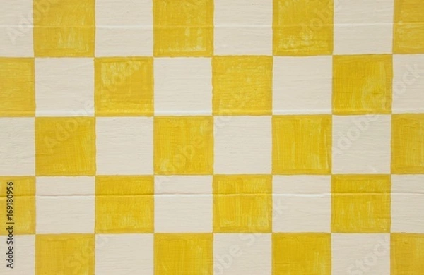 Fototapeta Yellow and white checkerboard design on wood panel background