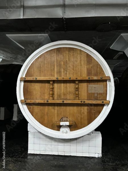Fototapeta Wine barrels in wine-vaults in order.