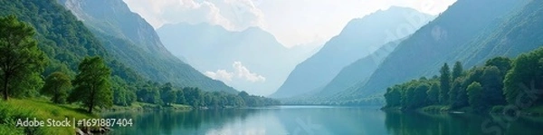 Fototapeta Serene mountain landscape perfect for a peaceful retreat Misty peaks, lush green valley, and a tranquil lake offer a sense of calm and rejuvenation , nature, exploration