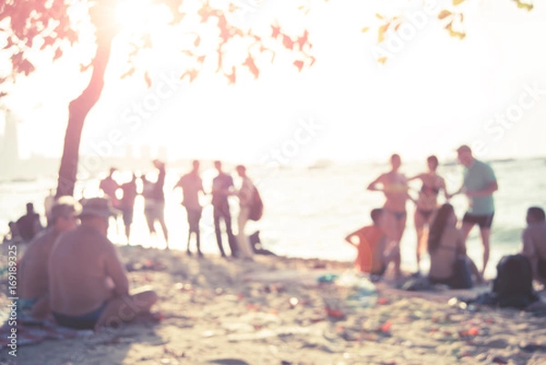 Fototapeta People sit on the beach in Pattaya, Thailand, and the picture is unclear and blurry