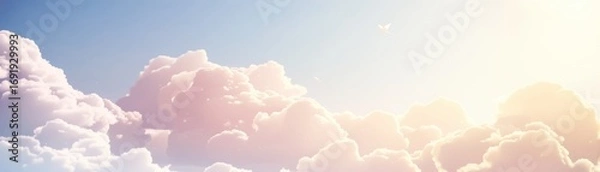 Fototapeta A serene sky filled with fluffy clouds and a soft, warm light, creating a peaceful and uplifting atmosphere.