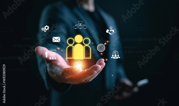 Fototapeta Concept of customer relationship management (CRM), digital marketing. A person holds glowing CRM icon with virtual interface, representing customer engagement, sales process, business strategy.