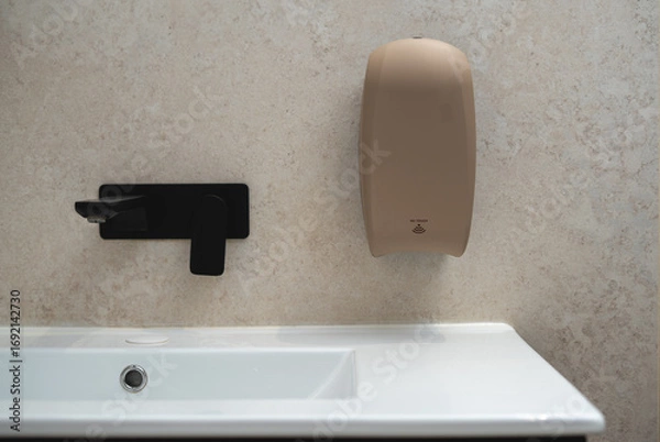 Fototapeta Automatic soap dispenzer sand texture and color