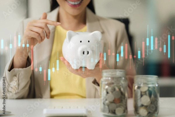 Fototapeta Businesswoman are calculating income-expenditure and analyzing real estate investment data at office, Accounting Financial and tax systems concept.