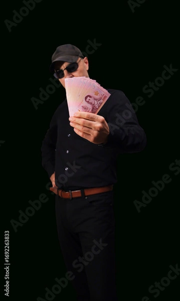 Fototapeta Counting and handling various banknotes in a secure setting during financial transactions
