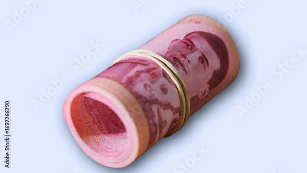 Fototapeta Handling currency notes during a transaction in a dimly lit environment with a focus on bills