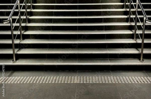 Fototapeta Close-up staircase in a building with beautiful light and shadow, no people, landscape image.