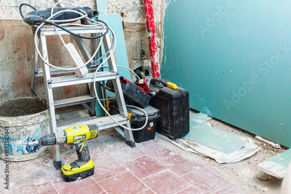 Fototapeta A construction site with interior repair tools, a room with many items needed for renovation. Telsiai,Lithuania.08-23-2025.