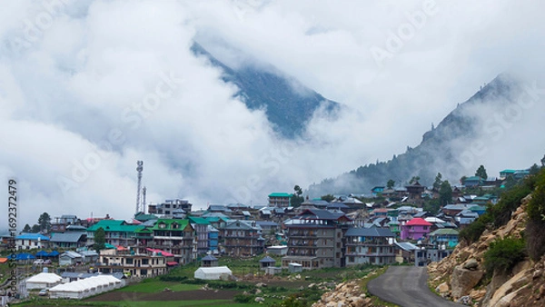 Fototapeta Panoramic View of Chitkul, Town Nestled Against the Mountain Range in Backdrop, Kinnaur, Himachal Pradesh, India.