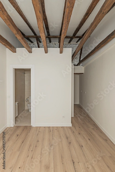 Fototapeta Large empty room with a stunning ceiling of centuries-old solid oak beams that show history in every grain and natural knot