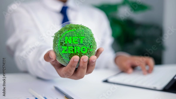 Fototapeta Business Person Holding Green Moss Globe with NET ZERO Text for Sustainability and Climate Action