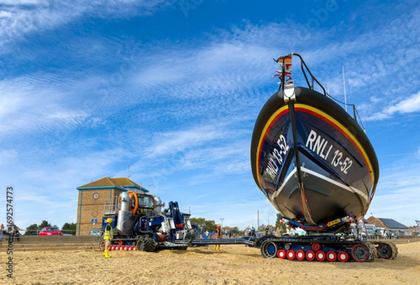 Fototapeta Lifeboat on rotating Beach Recovery and Launch Tractor Trailer
