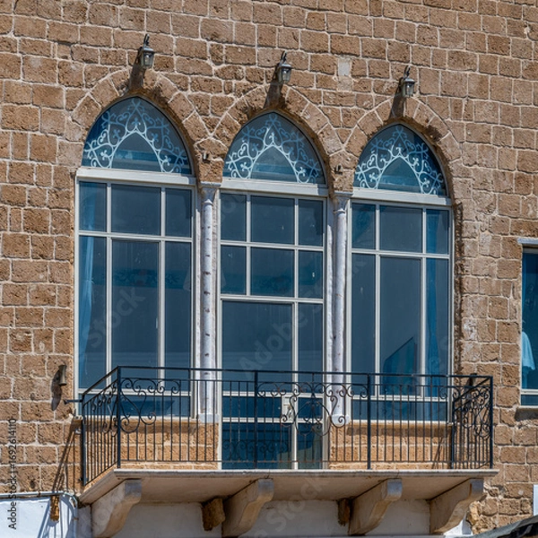 Fototapeta Interesting windows in Acre, Akko, Israel on a sunny day.
