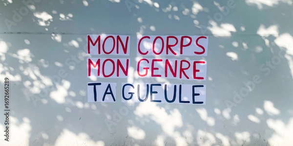 Obraz Protest poster pasted by members of a french feminist movement saying "my body, my gender, shut up"