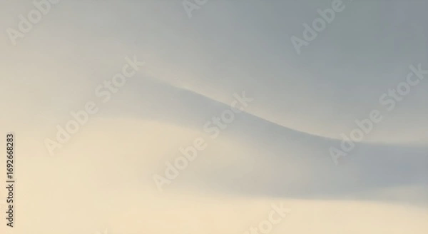 Fototapeta Soft abstract curved lines in pale blue and yellow tones suggest gentle waves or rolling terrain