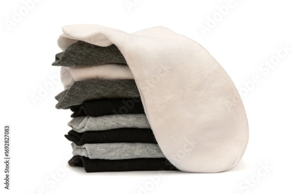 Fototapeta Men's new clean socks on a white background. White, gray and black colors.