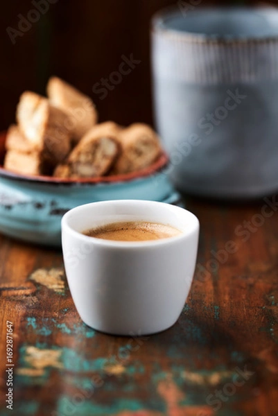 Fototapeta Cup of coffee on rustic wooden background. Soft focus. Copy space	
