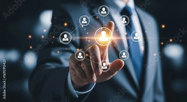Fototapeta Businessman interacts with a digital network of people icons and connections