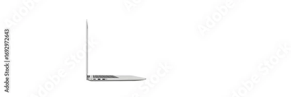 Fototapeta Sleek and Modern Laptop: A side view showcases a slim, silver laptop against a clean backdrop, perfect for illustrating technology, design, and productivity. 