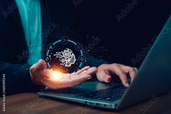 Fototapeta Businessman using laptop with holographic AI interface show automation and data icons. Concept artificial intelligence, machine learning, digital innovation, business analytics and future technology.
