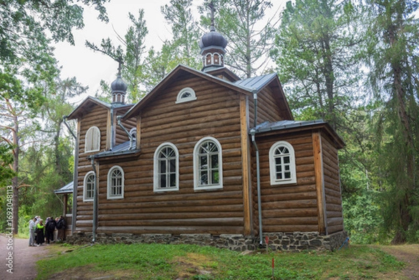 Fototapeta Church of Konevsky Skete. Valaam Island. Pilgrims at the entrance to the church