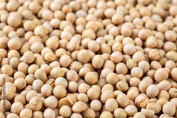 Fototapeta Raw dehydrated soybeans texture background top view.