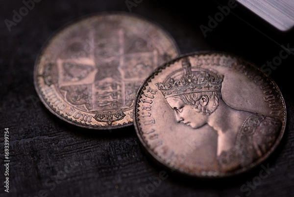 Fototapeta Victoria coin collection featuring old crown coins with queen victorias portrait. Texture detail suitable for historical websites, numismatic blogs.