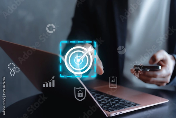 Fototapeta Businessman with target arrow virtual digital technology icon, business investment objectives and goals Marketing strategies and goals for success concept idae.
