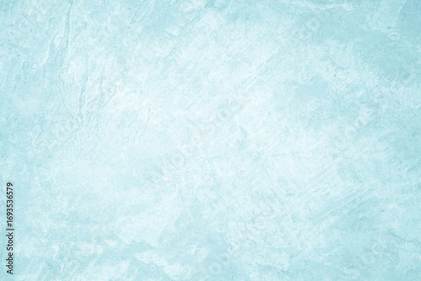 Fototapeta Pastel blue and white concrete stone texture for background in summer wallpaper. Cement and sand wall of tone vintage. Concrete abstract wall of light cyan color, cement texture mint green for design.