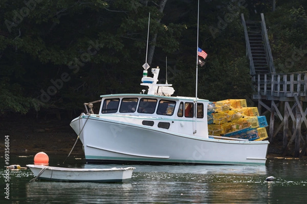Obraz Lobster boat moored in early autumn in South Bristol, Maine, United States