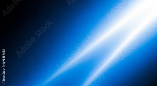 Fototapeta Abstract Blue Light Rays Streaking Across a Dark Background