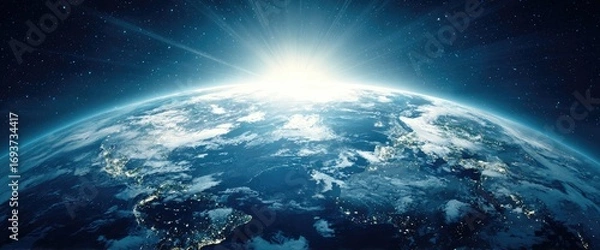 Fototapeta Earth seen from space, sunrise illuminating the globe